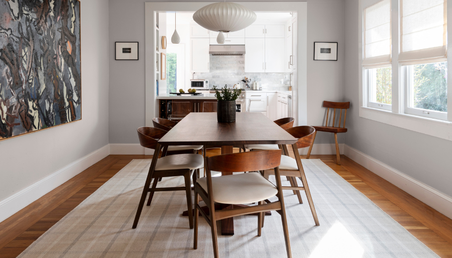 Dining room with plaid area rug 