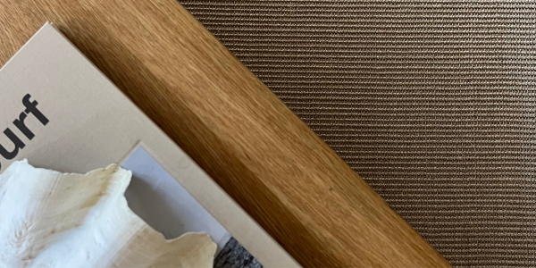 Sisal Rug with coffee table and book 